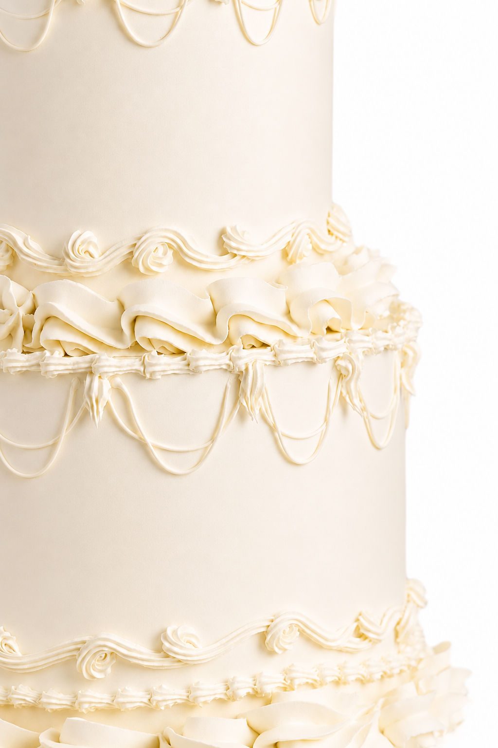 Two-tier white and gold pearl-detailed cake