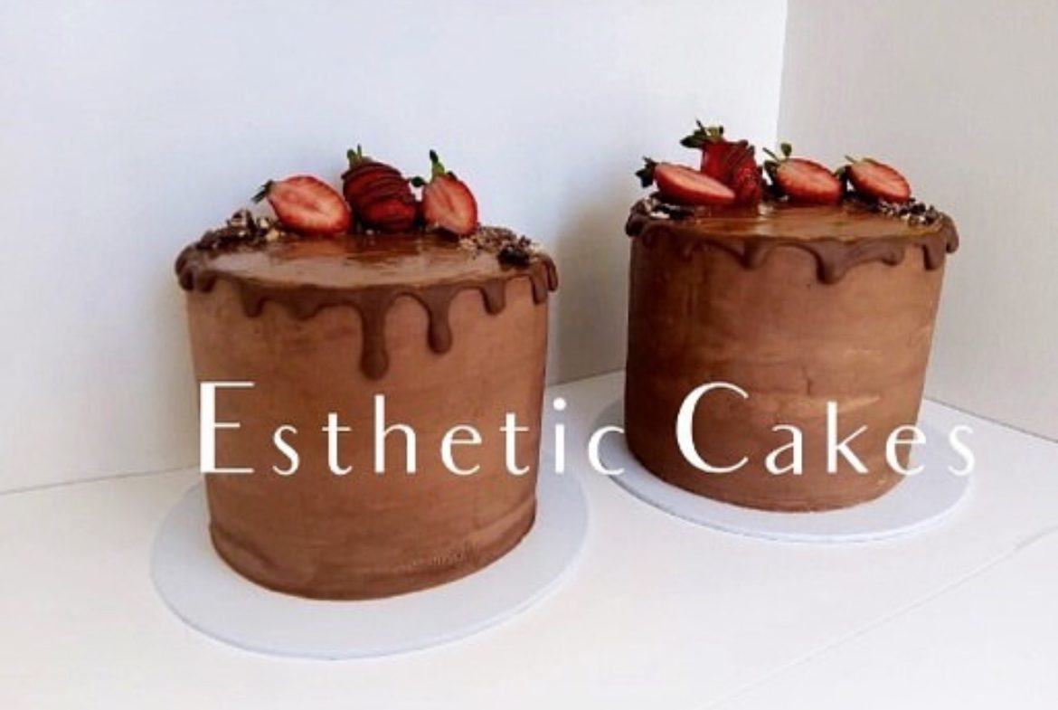 Chocolate cakes topped with fresh strawberries and gold detail