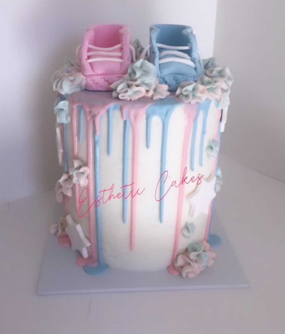 Pink and blue drip 12th birthday cake with sprinkles