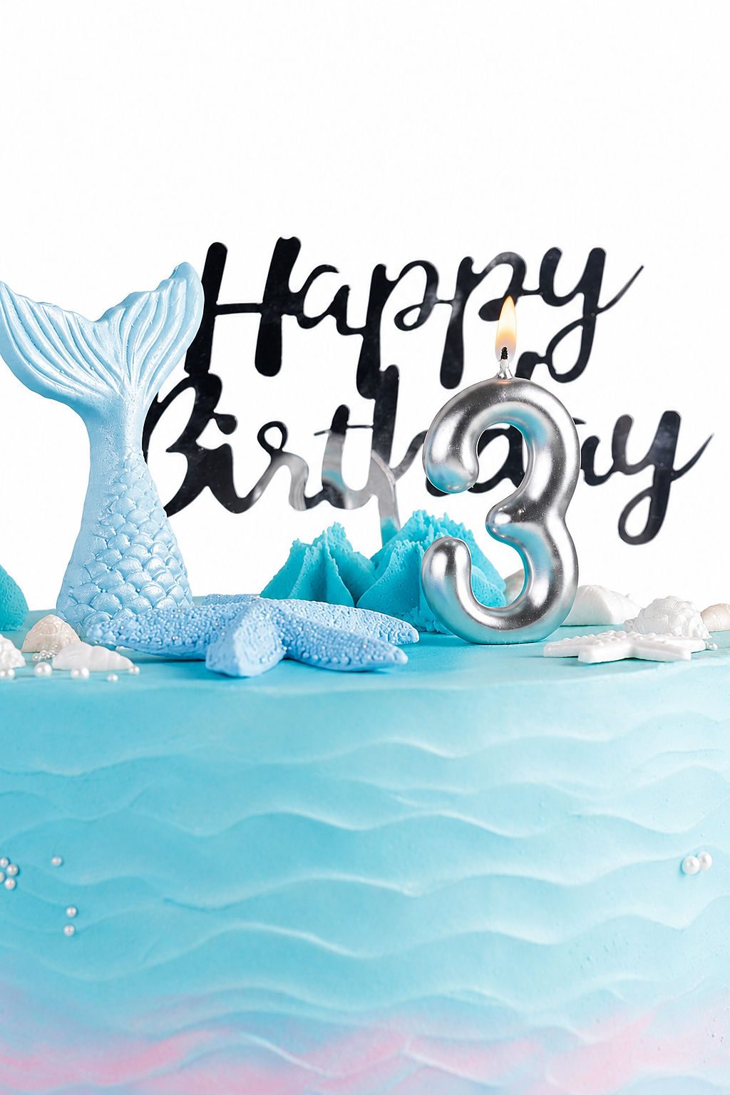 Sky blue mermaid birthday cake with gold happy birthday topper