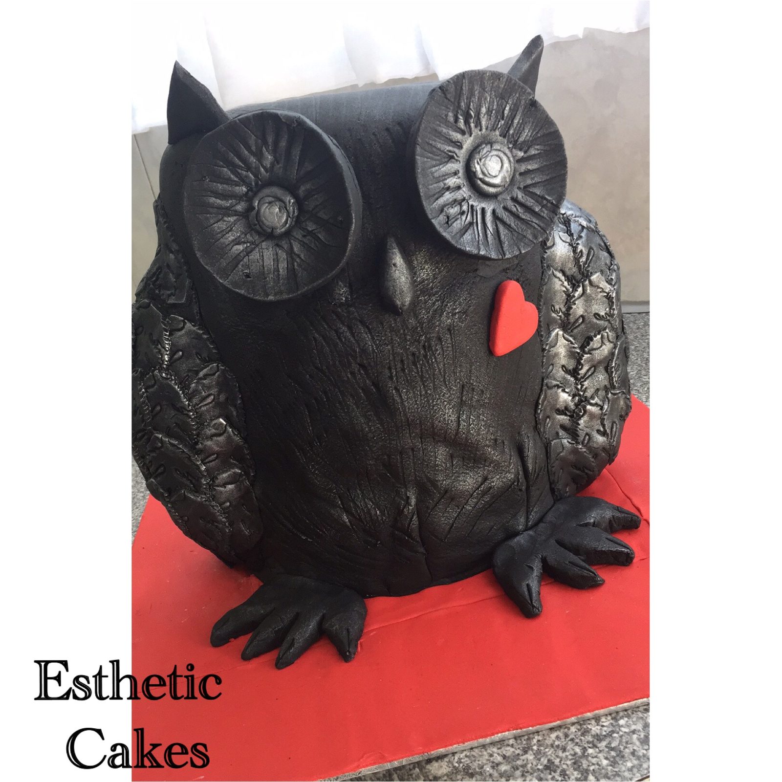 Sculpted black owl novelty cake