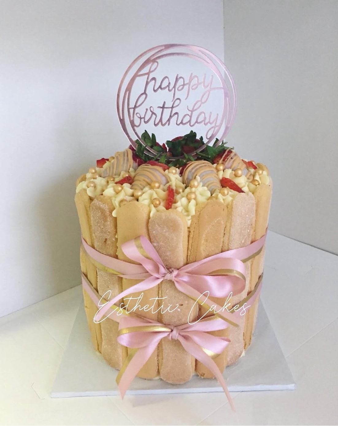 Cream buttercream birthday cake with gold happy birthday topper