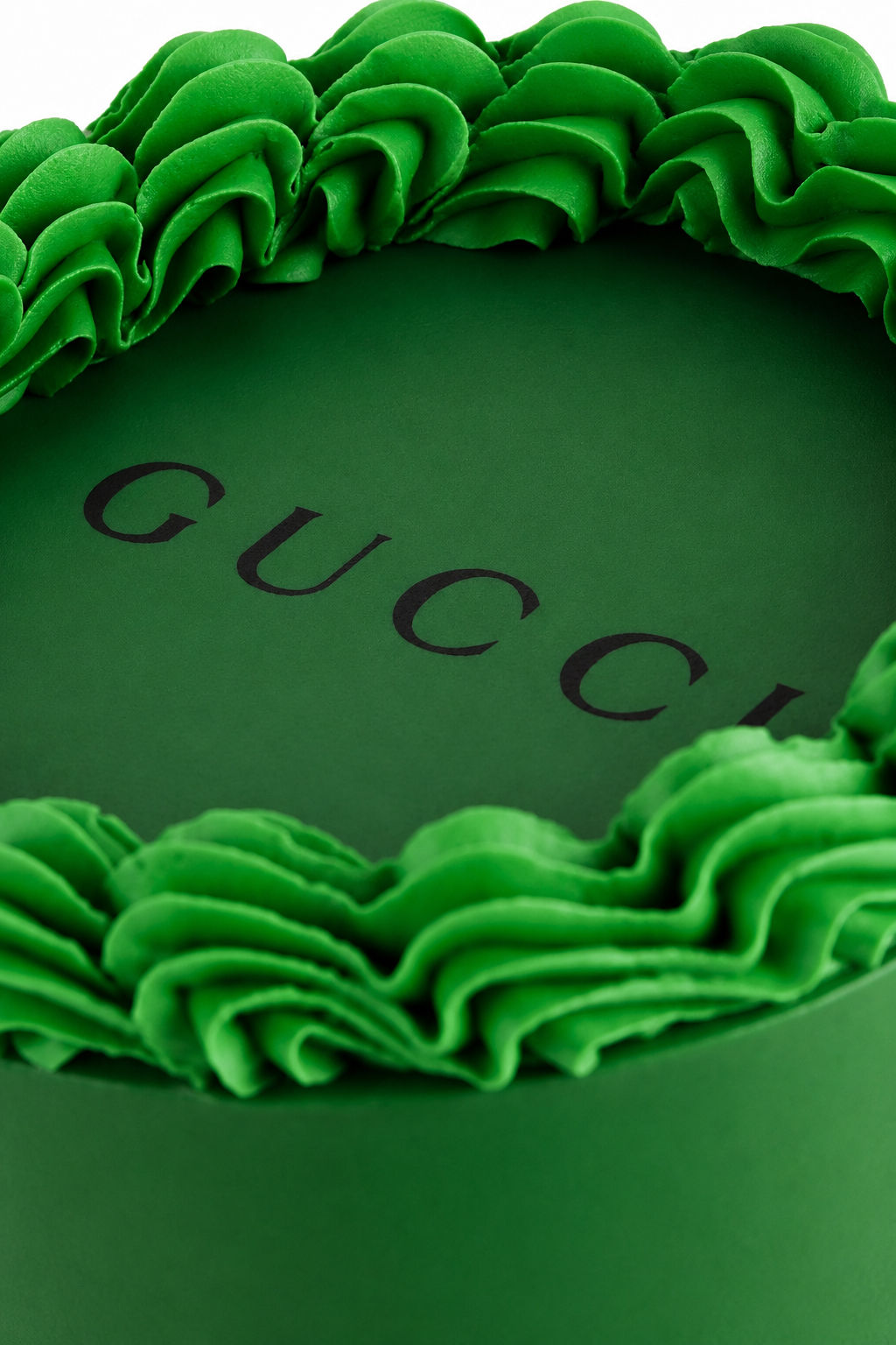 Emerald green designer cake with ruffled buttercream borders