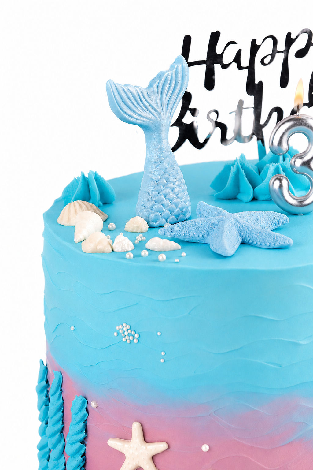 Blue and pink ombré mermaid third birthday cake with sea creatures