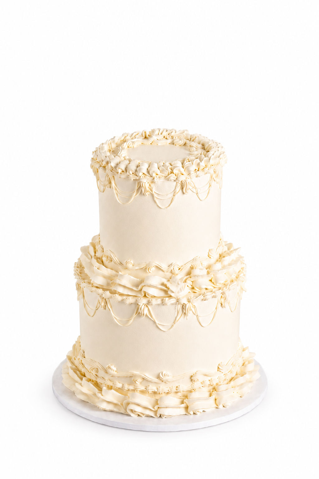 Two-tier vintage ivory buttercream cake with piped scrollwork