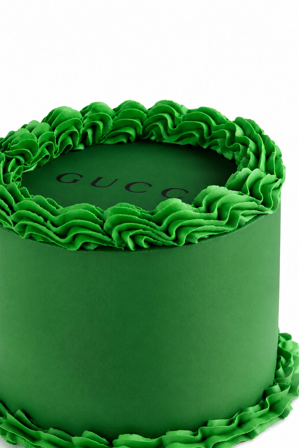 Emerald green ruffled designer cake with contrasting dark base